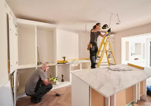 Contractors updating a kitchen during home renovations in Central Illinois