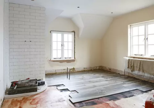 A bathroom being retiled, part of Johnson's Building Company's home renovations in Illinois
